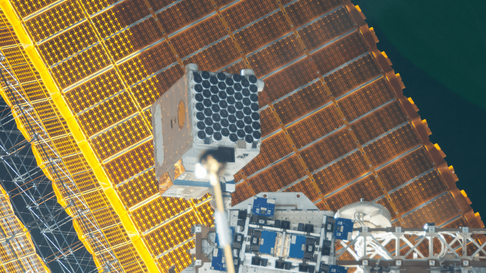 View of the Neutron Star Interior Composition ExploreR (NICER) payload, attached to ExPRESS (Expedite the Processing of Experiments to Space Station) Logistics Carrier-2 (ELC-2) on the S3 Truss. Credits: NASA